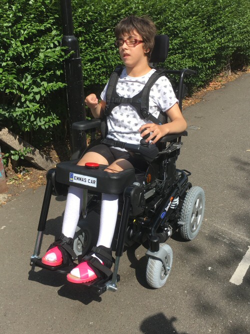 Emma in her new car Invacare Spectra XTR